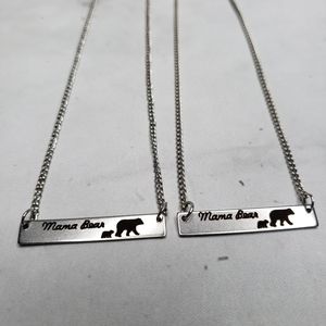 Mama bear silver colored necklace